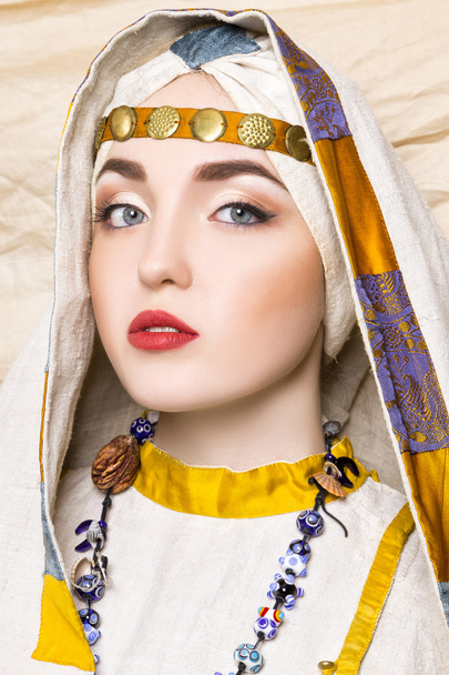 Portrait of slavic women from the past. Historical reconstruction. National vintage clothing. Studio - Photo, image