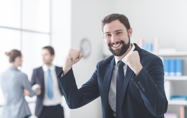 Cheerful businessman with raised fists - Photo, Image