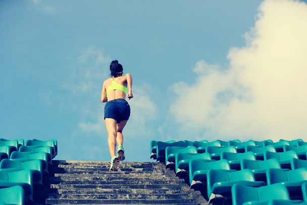 athlete running up on stairs - Photo, Image