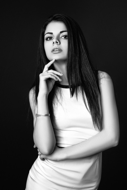 fashion style studio photo of a cute brunette, on white background. Black and white - Fotografie, Obrázek