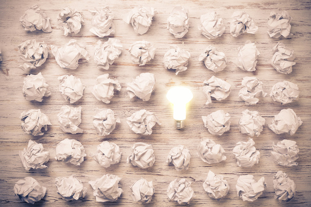 balls of crumpled paper and light bulb - Photo, Image