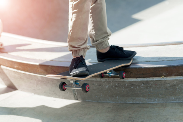 Legs of riding skateboarder - Fotó, kép