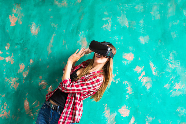 technology, virtual reality, entertainment and people concept - woman with vr headset playing game. - Photo, Image