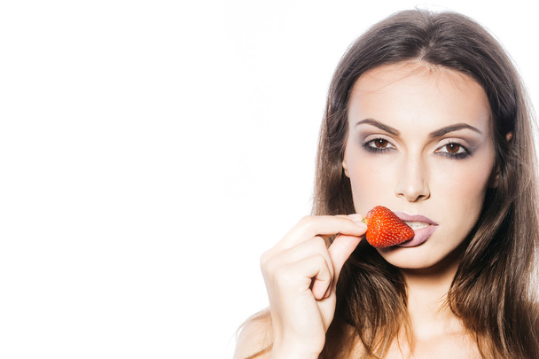 sexy woman eating red strawberry - Photo, Image