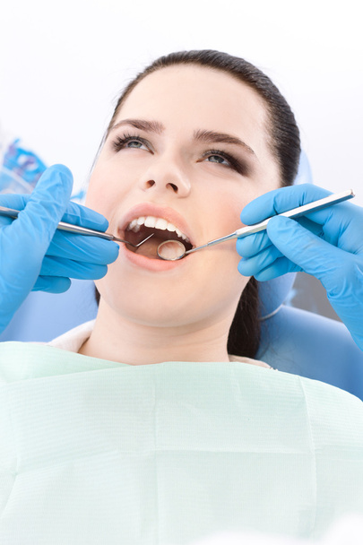 Dentist examines the dentes of the patient - Photo, Image