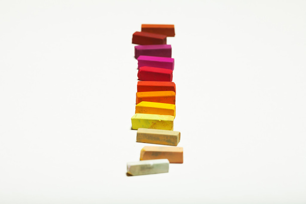 Diversity concept. Sheet of blank white paper with spectrum of warm colors - Fotoğraf, Görsel