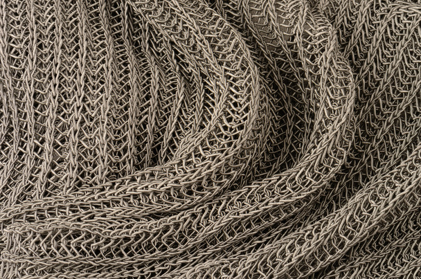Close-up van grijze gebreide trui achtergrond - Foto, afbeelding
