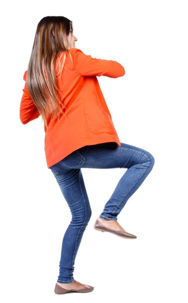 back view of woman funny fights waving his arms and legs. - Foto, imagen