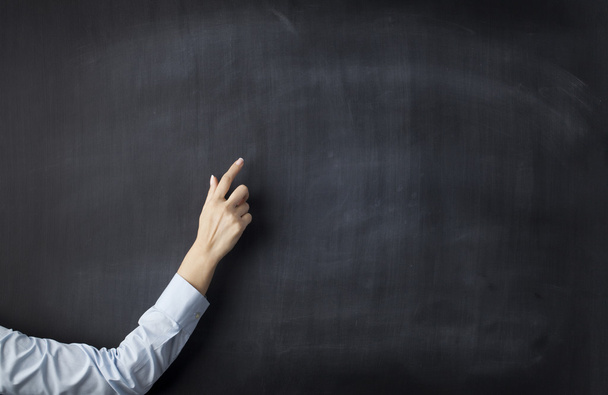 Blank blackboard with businesswoman hand pointing - Foto, afbeelding