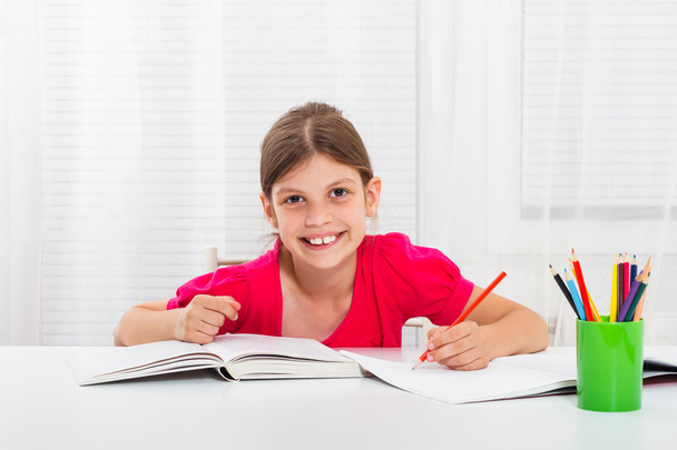  little girl drawing and writing - Фото, изображение