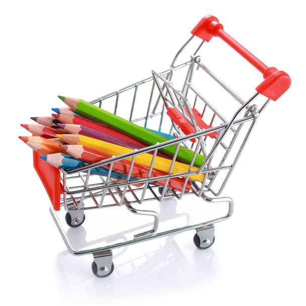 Color pencils in shopping cart isolated - Photo, Image
