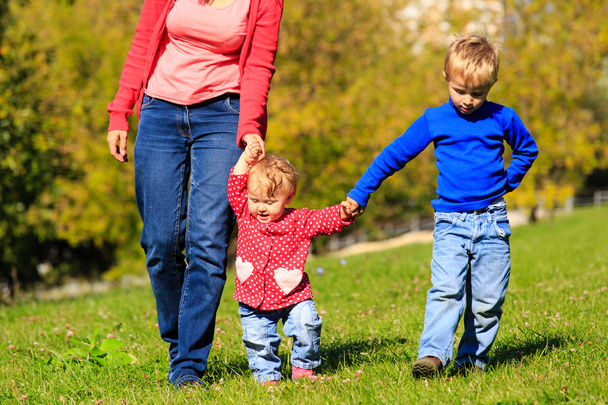 mother with little son and daughter walking - Photo, image