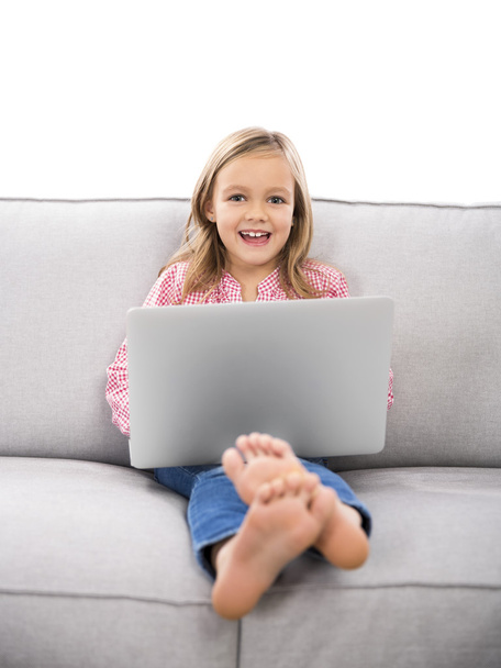 girl on couch working laptop - Фото, зображення