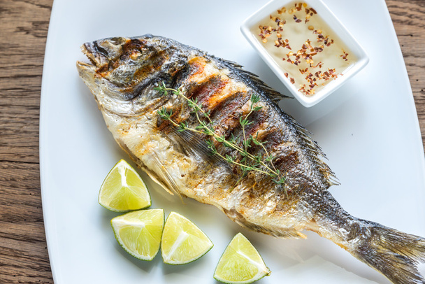 Grilled Dorade Royale Fish on the plate - Valokuva, kuva
