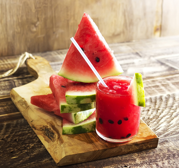 Fresh water melon smoothie on a wooden background, rural style, selective focus - Photo, image