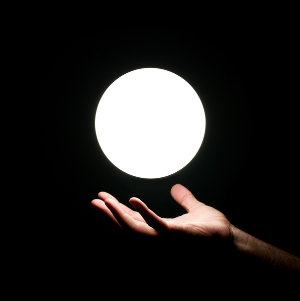 Lichtkugel über menschlicher Hand - Foto, Bild
