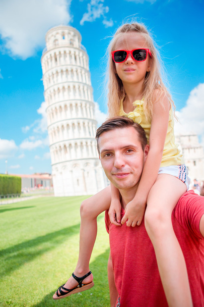 Family portrait background the Learning Tower in Pisa. Pisa - travel to famous places in Europe. - Photo, Image