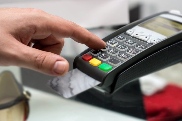 Credit or debit card password payment. Customer hand is entering - Foto, Imagem
