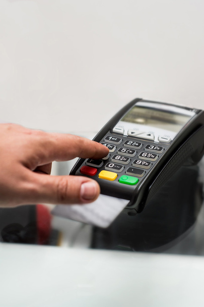 Credit or debit card password payment. Customer hand is entering - Photo, Image