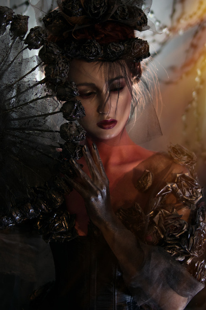 dark queen in fantasy costume - Fotó, kép