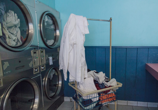 Washing clothes and drying at the Laundromat - Photo, Image