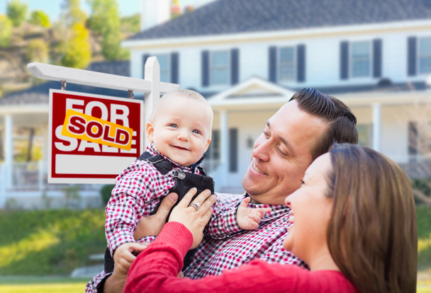Young Family In Front of For Sale Sign and House - Photo, Image