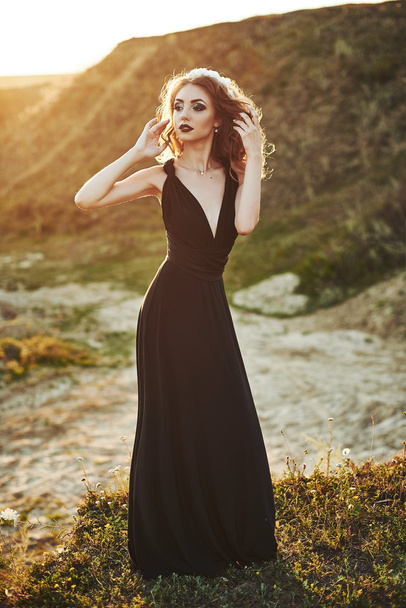 Model in black dress outdoors - Fotó, kép