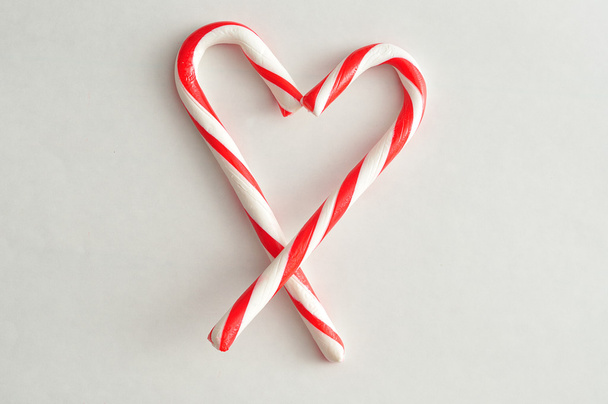 Candy canes in the shape of a heart - Fotoğraf, Görsel