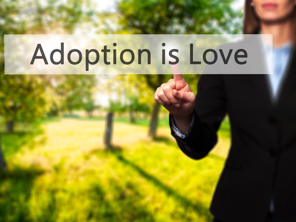 Adoption ist Liebe - isolierte weibliche Hand, die berührt oder auf die sie zeigt  - Foto, Bild