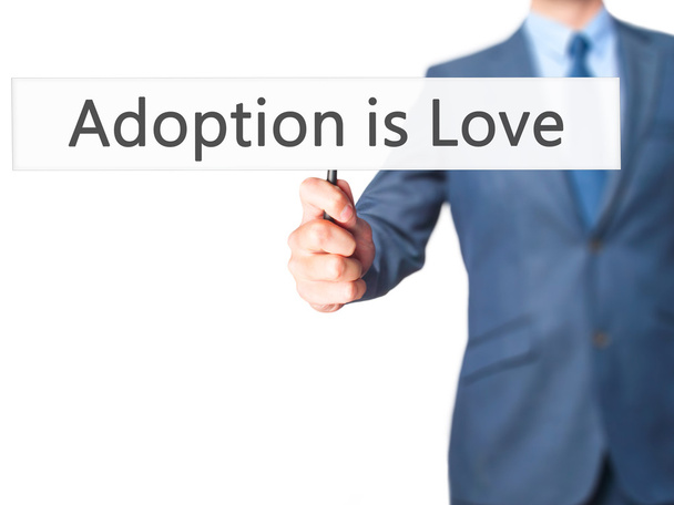 Adopcja jest miłość-biznes człowiek pokazując znak - Zdjęcie, obraz
