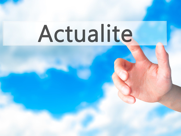 Actualite (News in French) - Hand pressing a button on blurred b - Photo, Image