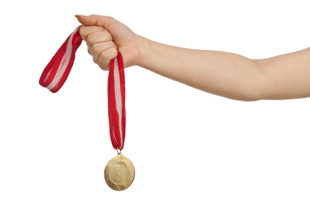 Hand holding gold medal on white - Foto, Imagem
