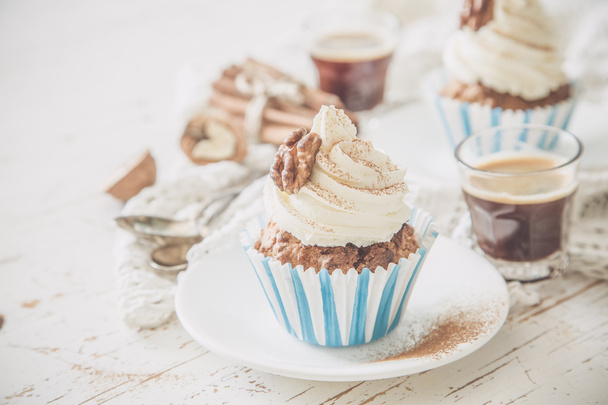 Carrot cake cupcakes with butter cream frosting - Photo, image