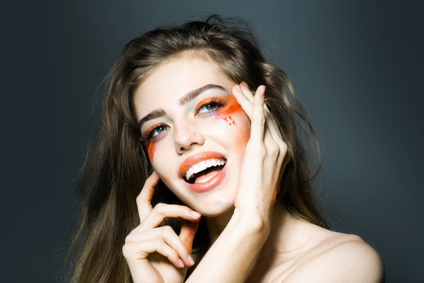 Girl with orange makeup closeup - Fotografie, Obrázek