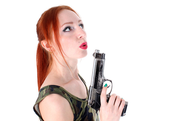 Young beautiful Woman holding Handgun - Photo, image