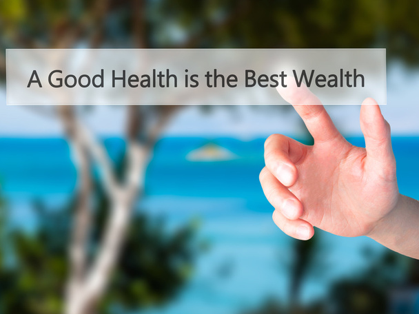 Una buona salute è la migliore ricchezza - Mano premendo un pulsante su blu
 - Foto, immagini