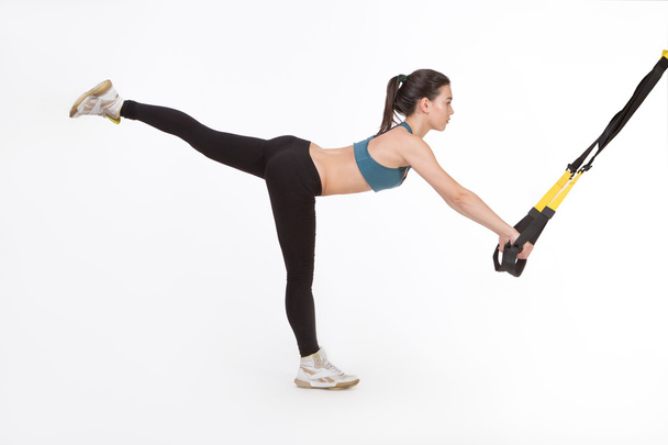 Woman training with suspension trainer sling - Foto, Imagem