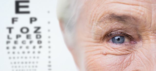 close up of senior woman face and eye - Foto, Imagen