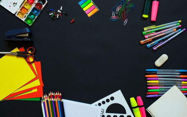School supplies on blackboard background ready for your design - Photo, Image