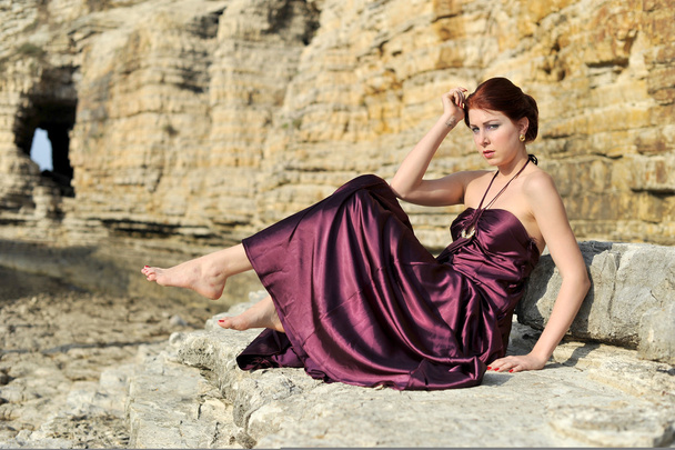 beautiful young attractive fashion model wearing claret red dress on nature - Photo, Image