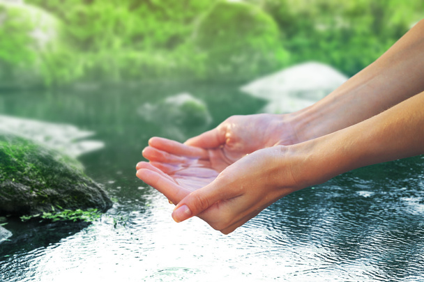 Clear natural water in woman hands  - Foto, immagini