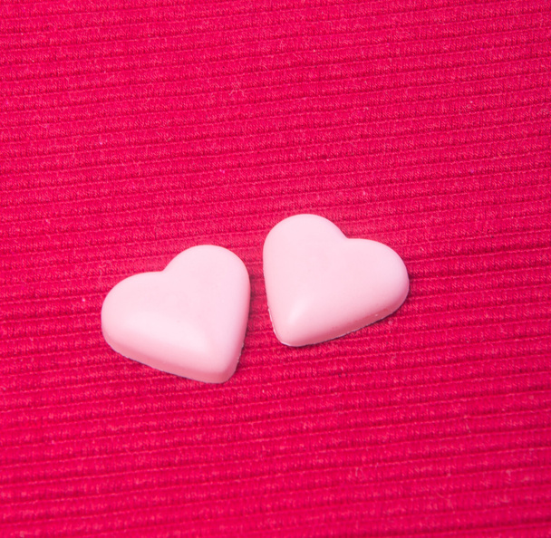 chocolate in pink colour or love shape chocolate. - Fotó, kép