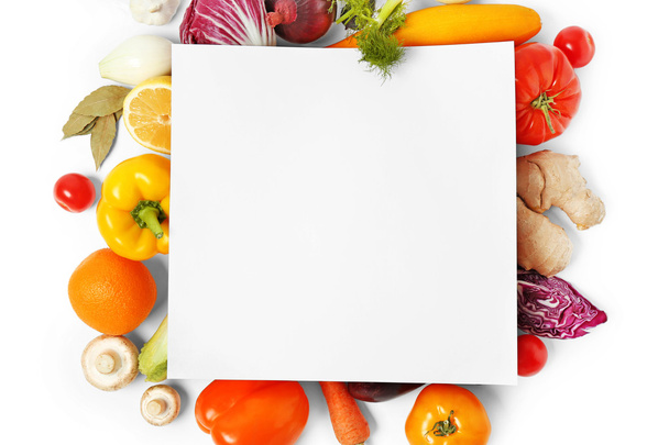 Vegetables and sheet of paper o - Фото, изображение