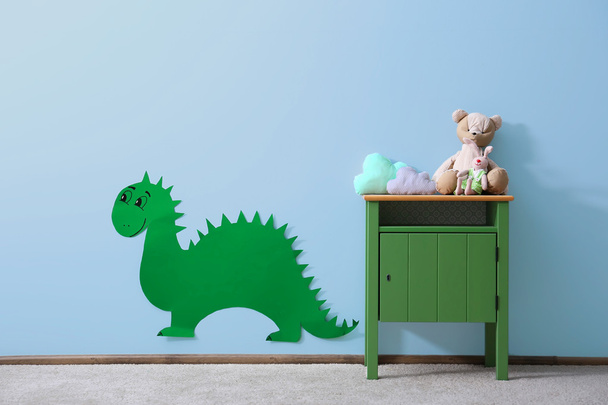 Green bedside table with toys  - Photo, Image