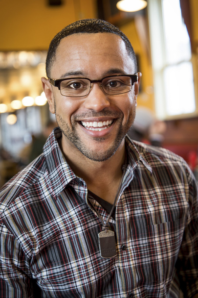 Portrait of Young Black Man in Coffee Shop - Photo, Image