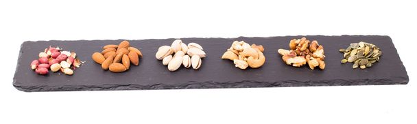Nuts on slate  - Foto, afbeelding