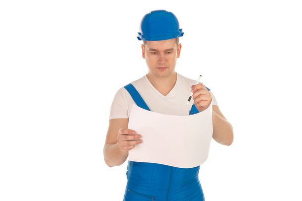 male construction worker in a blue uniform - Φωτογραφία, εικόνα