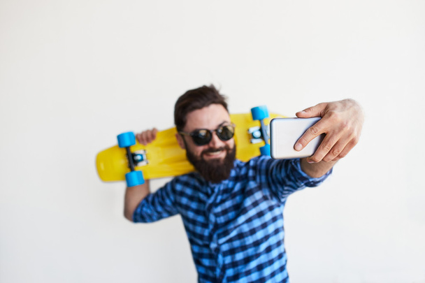 bearded hipster taking selfie - Photo, Image