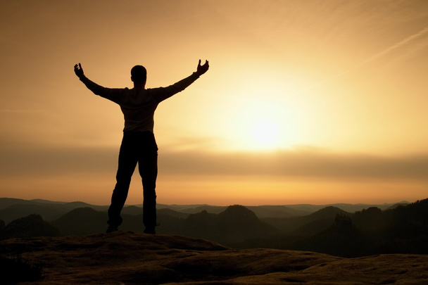 Happy man with open raised arms Gesture of triumph. Satisfy hiker  silhouette  - Photo, Image