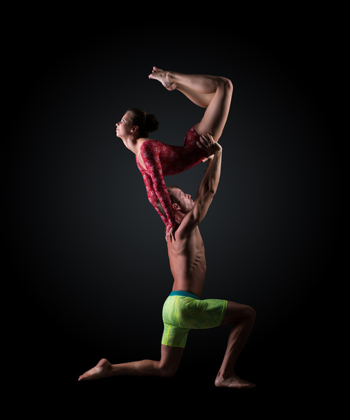 Young athletes perform acrobatic support - 写真・画像